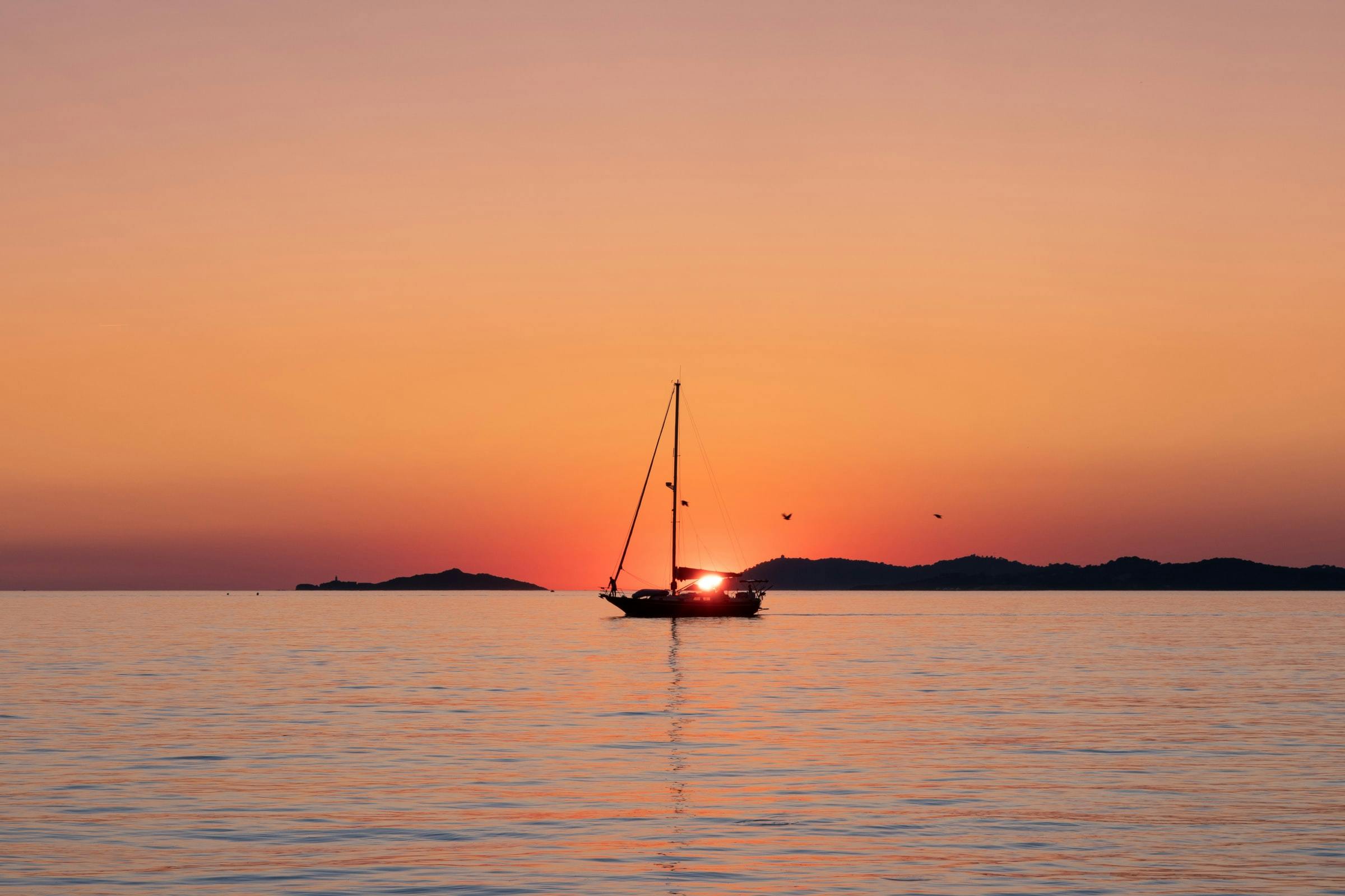 Boat in an orange and red sunset