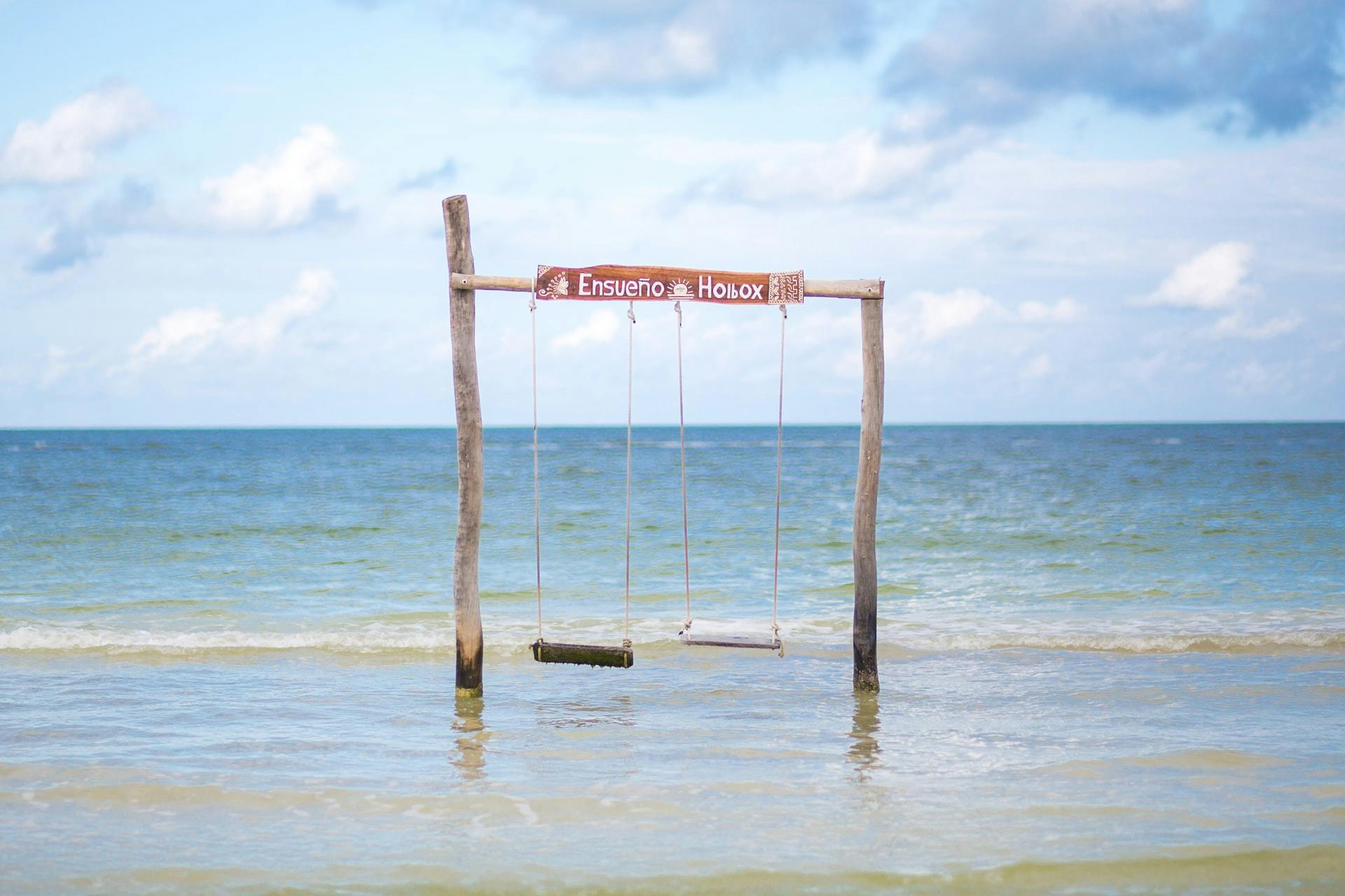 Holbox beach wood swing