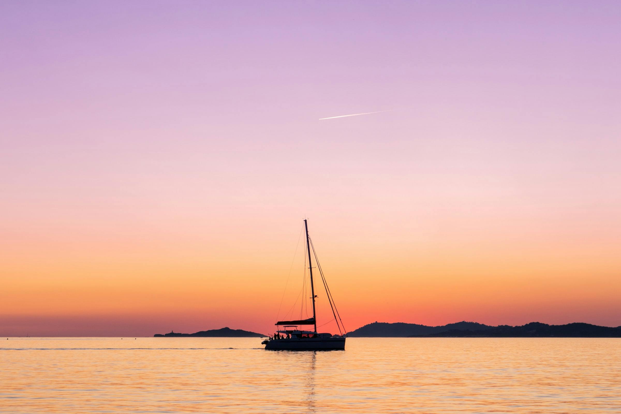 Boat in an purple, orange and red sunset